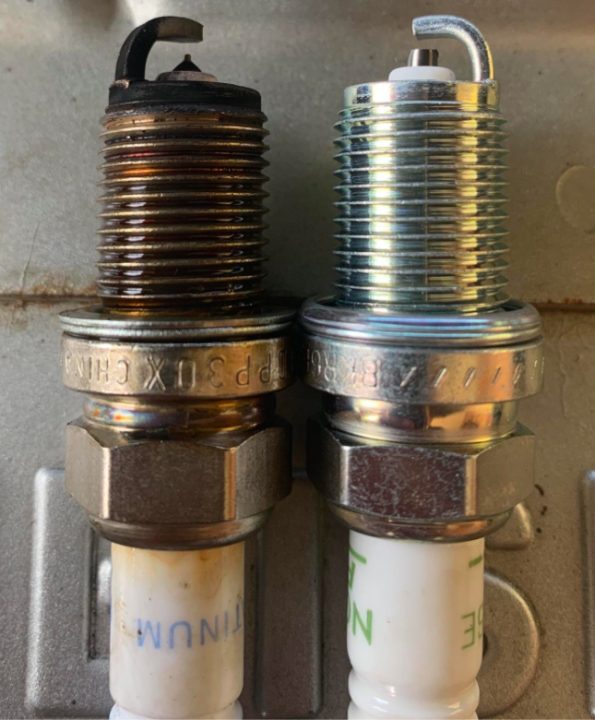 new and old spark plugs